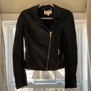 Michael kors leather jacket size 4, gold zipper details and a-symmetrical zip up